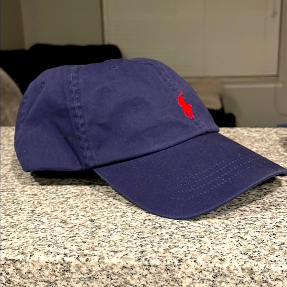 Brand new never worn polo hat, navy blue in color